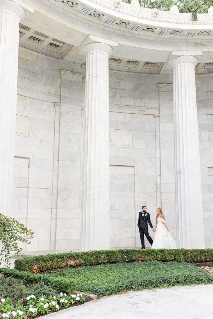 William McKinley Memorial Wedding portraits bride and groom walking in the garden