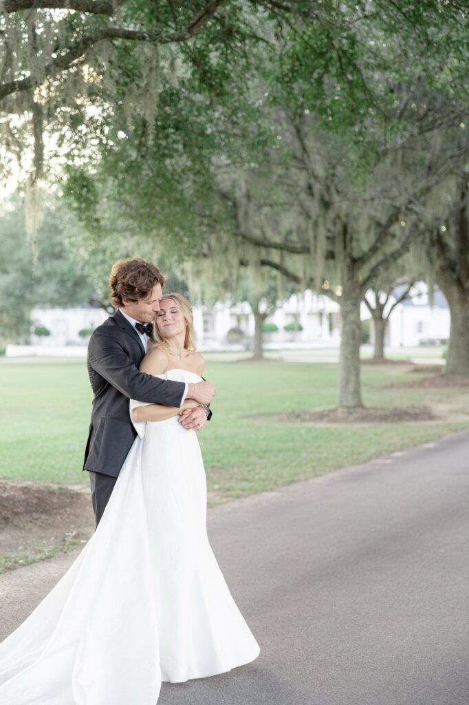 Fox Hill Plantation Wedding Couple hugging in driveway