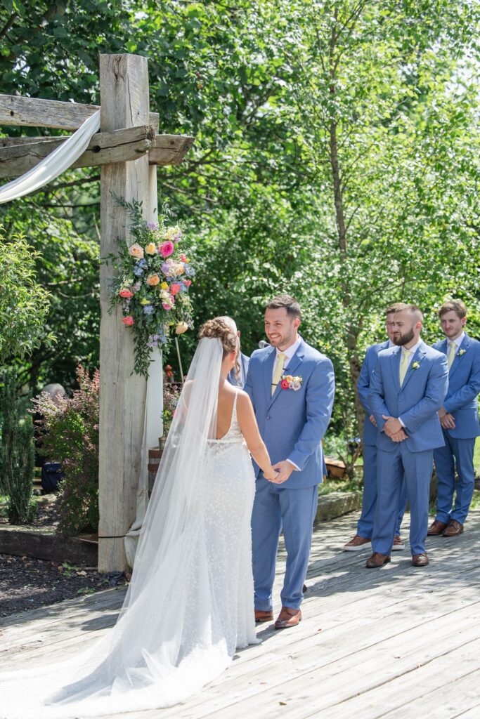 Outdoor summer wedding Cleveland Ohio Bride and Groom exchanging vows