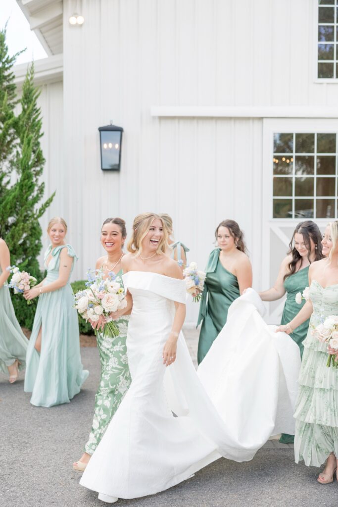 Cleveland Wedding Photographer Travels to Fox Hill Plantation Wedding Bride and Bridesmaids walking together