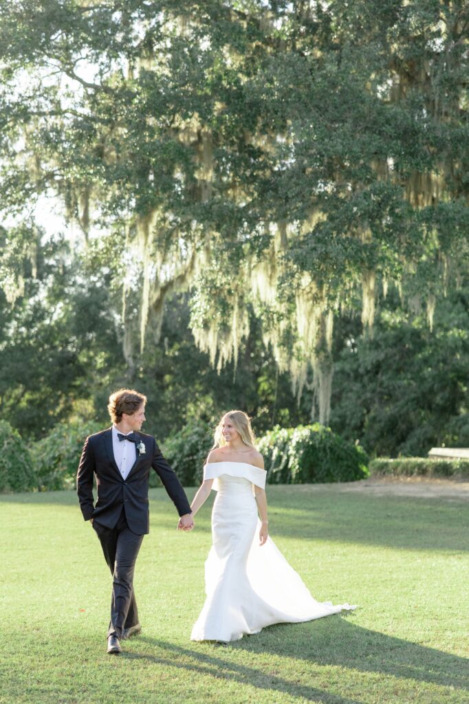 Fox Hill Wedding Golden Hour Spanish Moss Bride and Groom walking together