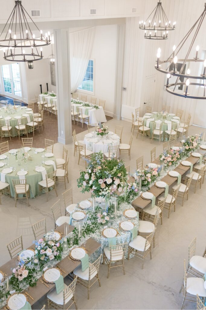 Fox Hill Wedding Reception Space white building with chandeliers and extravagant tablescapes