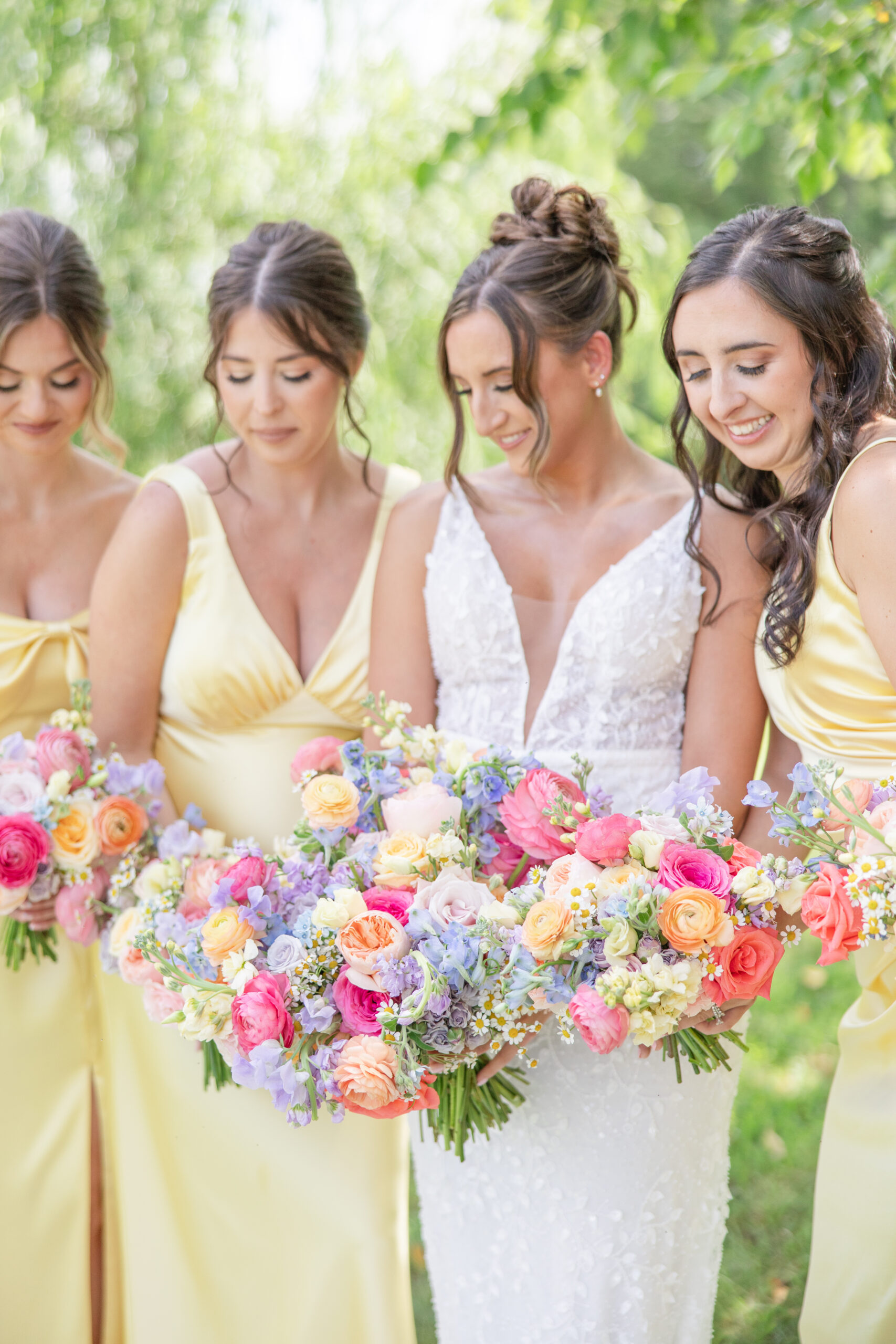 Romantic Outdoor garden wedding Cleveland Wedding Photographer Bride and Bridesmaids holding colorful bouquets