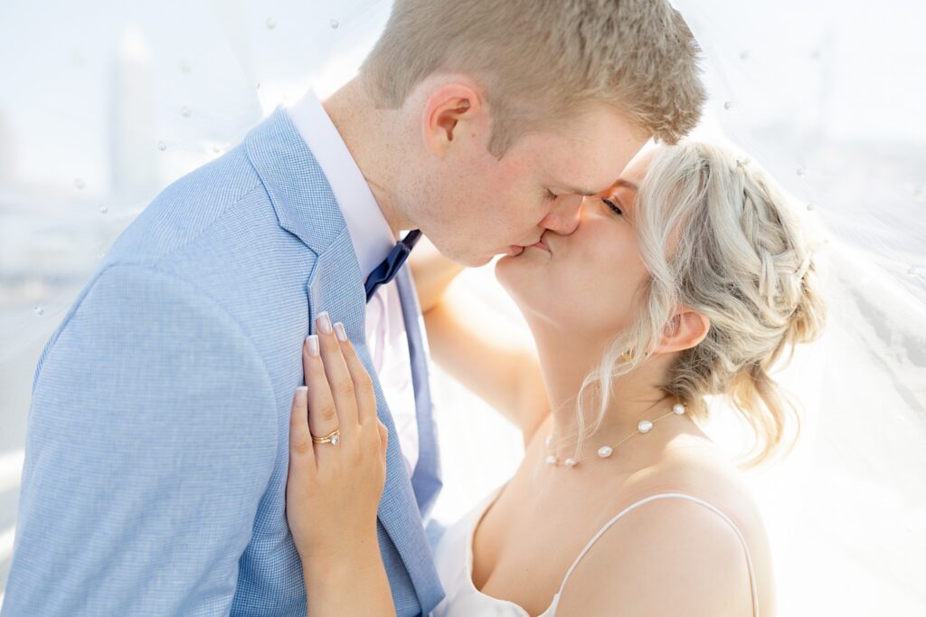 Cleveland waterfront wedding photographer light and airy coastal wedding under the veil bride and groom portraits